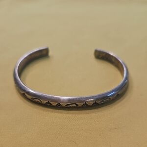 Vintage sterling silver Native American cuff bracelet with a stamped Pattern
